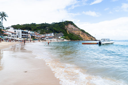 Cairu, Bahia, Brazil - January 19, 2023: People bathing and walking on Morro de Sao Paulo beach, in the city of Cairu.のeditorial素材
