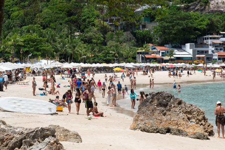 Cairu, Bahia, Brazil - January 19, 2023: People walking on the sands of Morro de Sao Paulo beach, in the city of Cairu.のeditorial素材