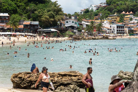 Cairu, Bahia, Brazil - January 19, 2023: People walking on the sands of Morro de Sao Paulo beach, in the city of Cairu.のeditorial素材
