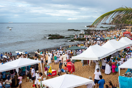 Salvador, Bahia, Brazil - February 02, 2023: Thousands of people are on the beach offering gifts to Iemanja on Rio Vermelho beach in Salvador.のeditorial素材
