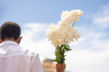Salvador, Bahia, Brazil - February 02, 2023: Believers of the Camdonble religion are holding flowers to offer to Iemanja in Salvador, Bahia.のeditorial素材