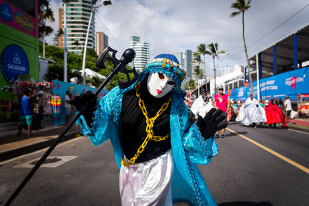 Salvador, Bahia, Brazil - February 11, 2023: Custom people dance and play in the street during the pre-carnival Fuzue parade in the city of Salvador, Bahia.のeditorial素材