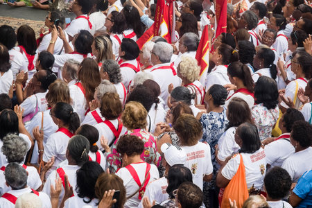 Salvador, Bahia, Brazil - May 26, 2016: Dozens of Catholic faithful are seen at the outdoor mass in...