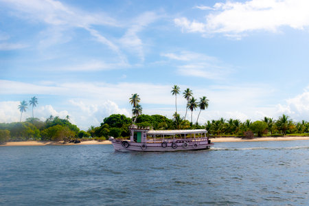 Valenca, Bahia, Brazil - January 19, 2023: Boat sailing in the waters of the Rio Una in the city of Valenca in Bahia.のeditorial素材