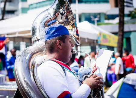 Salvador, Bahia, Brazil - February 11, 2023: Musician playing Tuba during the pre-carnival Fuzue parade in Salvador, Bahia.のeditorial素材