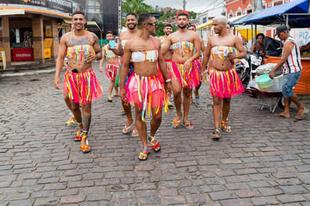 Maragogipe, Bahia, Brazil - February 20, 2023: Group of men dressed as women are parading in the...