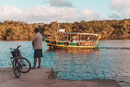 Valenca, Bahia, Brazil - September 09, 2022: Boat sailing on the Una river in the late afternoon...
