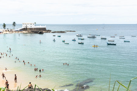 Salvador, Bahia, Brazil - January 14, 2022: High view of Santa Maria fort and tourist people having fun at Porto da Barra beach in Salvador, Bahia.のeditorial素材