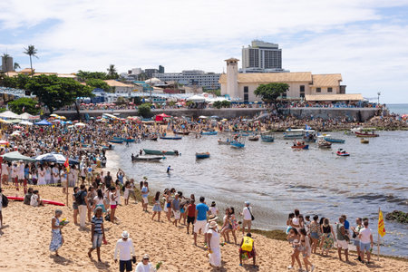 Salvador, Bahia, Brazil - February 02, 2023: Thousands of people are on the beach offering gifts to Yemanja on Rio Vermelho beach in Salvador.のeditorial素材