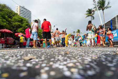 Salvador, Bahia, Brazil - February 11, 2023: People dance, jump and play in the street during the pre-Carnival Fuzue parade in the city of Salvador, Bahia.のeditorial素材