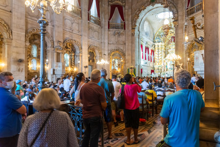 Salvador, Bahia, Brazil - December 08, 2022: Faithful are praying at the mass in honor of Nossa Senhora da Conceicao da Praia, in the city of Salvador, Bahia.のeditorial素材