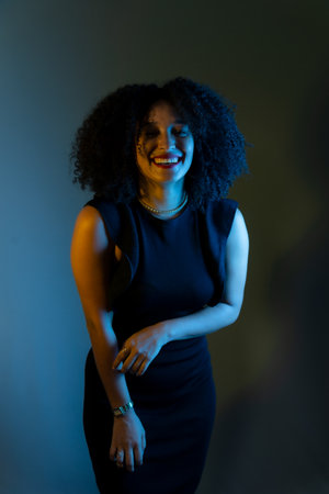 Portrait of beautiful young woman smiling and confident. color portrait in studioの写真素材