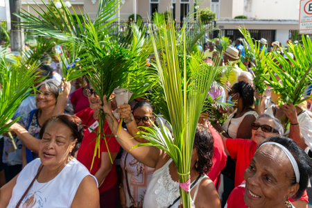 Salvador, Bahia, Brazil - April 02, 2023: Catholic worshipers hold palm branches for Palm Sunday mass in Salvador, Bahia.のeditorial素材