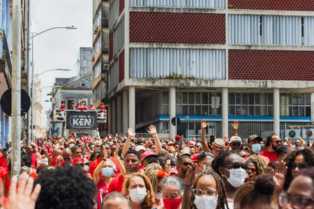 Salvador, Bahia, Brazil - December 04, 2022: Crowd of faithful Catholics accompany the procession in honor of Santa Barbara in the city of Salvador, Bahia.のeditorial素材