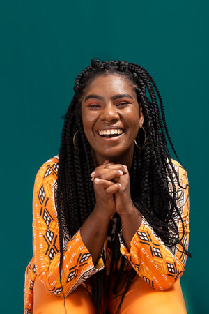 Beautiful woman happy and peaceful. Isolated on green background.の写真素材