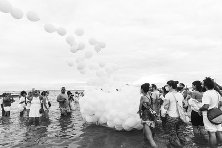 Santo Amaro, Bahia, Brazil - May 15, 2022: Candomble worshipers are seen on Itapema beach during the Bembe do Mercado celebrations, in the city of Santo Amaro.のeditorial素材