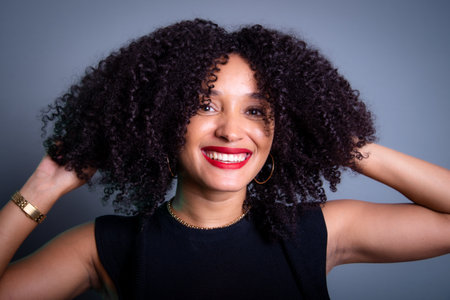 Close-up portrait of a beautiful young woman with black hair. studio portraitの写真素材