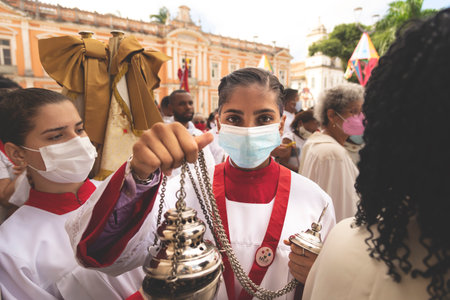 Salvador, Bahia, Brazil - June 16, 2022: Catholics are seen holding incense in the Corpus Christi...
