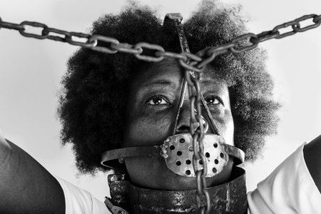 Portrait of a black woman in chains, representing the slave Anastacia. Slavery in Brazil.の写真素材