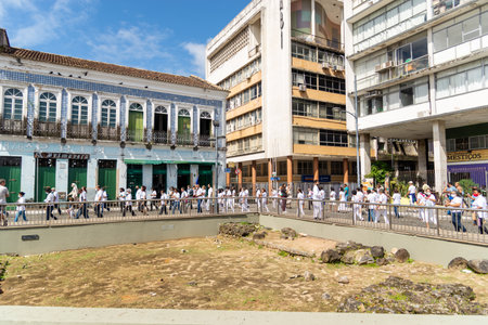 Salvador, Bahia, Brazil - June 16, 2022: Crowd of Catholic faithful are seen during a corpus christi procession in the streets of Pelourinho, Salvador, Bahia.のeditorial素材