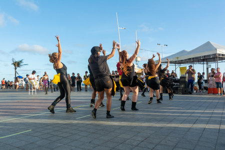 Salvador, Bahia, Brazil - October 22, 2022: Many people watching a dance performance at Farol da Barra in Salvador, Bahia.のeditorial素材