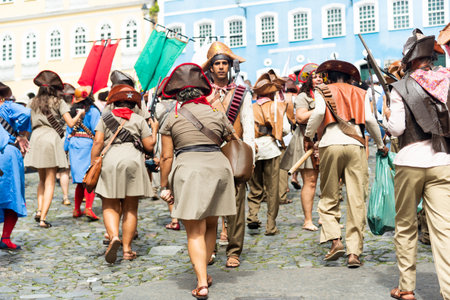 Salvador, Bahia, Brazil - July 02, 2022: Cultural group representing Cangaco are seen during the civic parade of the independence of Bahia, in Pelourinho in Salvador.のeditorial素材