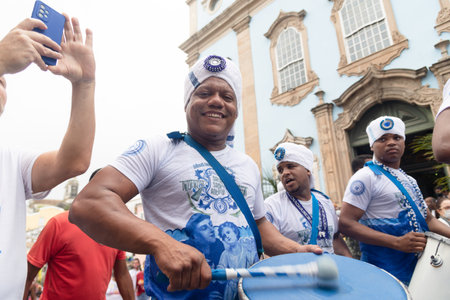 Salvador, Bahia, Brazil - July 02, 2022: Members of the afro group Filhos de Gandhy are seen during the civic parade for the independence of Bahia, at Pelourinho in Salvador.のeditorial素材
