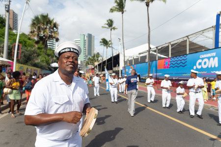 Salvador, Bahia, Brazil - February 11, 2023: Members of the Cheganca Frigata Brasileira de Saubara are seen at the Fuzue parade, pre-carnival in Salvador, Bahia, Brazil.のeditorial素材