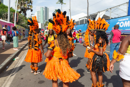 Salvador, Bahia, Brazil - February 11, 2023: Traditionally dressed group of indigenous peoples parade in Fuzue, pre-Carnival in Salvador in the Brazilian state of Bahia.のeditorial素材