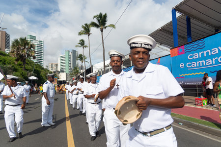 Salvador, Bahia, Brazil - February 11, 2023: Members of the Cheganca Frigata Brasileira de Saubara are seen at the Fuzue parade, pre-carnival in Salvador, Bahia, Brazil.のeditorial素材