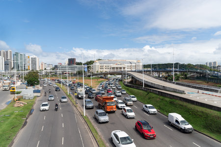 Salvador, Bahia, Brazil - August 11, 2023: Traffic movement of cars, buses and motorcycles near the Raul Seixas viaduct on Avenida Tancredo Neves in Salvador, Bahia.のeditorial素材