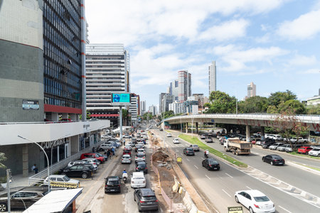 Salvador, Bahia, Brazil - August 11, 2023: View of a street close to Avenida Tancredo Neves with a construction site on the side. City of Salvador, Bahia.のeditorial素材
