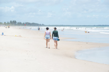 Valenca, Bahia, Brazil - December 27, 2022: People bathing in the sea and walking on Guaibim beach in the tourist town of Valenca, Bahia.のeditorial素材