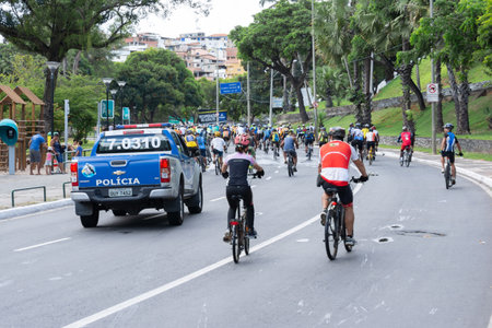 Salvador, Bahia, Brazil - January 04, 2015: Dozens of cyclists are seen accompanied by a Bahia Military Police car touring the streets of the city of Salvador, Bahia.のeditorial素材