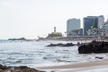 Salvador, Bahia, Brazil - August 25, 2023: View of the sea and Farol da Barra, postcard of the city of Salvador, Bahia.のeditorial素材
