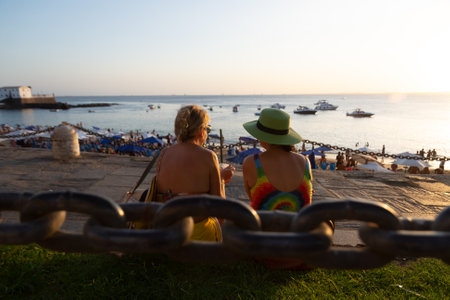 Salvador, Bahia, Brazil - August 25, 2023: People enjoy the sunset at Porto da Barra beach in Salvador, Bahia.のeditorial素材