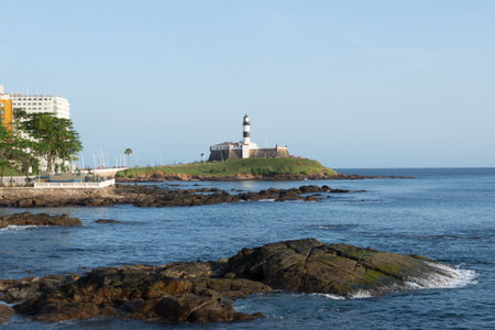 Salvador, Bahia, Brazil - August 25, 2023: View of the sea and Farol da Barra, postcard of the city of Salvador, Bahia.のeditorial素材