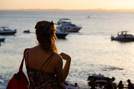 Salvador, Bahia, Brazil - August 25, 2023: People enjoy the sunset at Porto da Barra beach in Salvador, Bahia.のeditorial素材