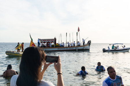 Salvador, Bahia, Brazil - December 31, 2021: The Galiota boat is seen leaving the beach with the...