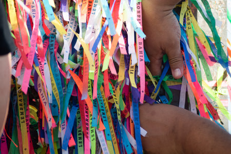 Salvador, Bahia, Brazil - January 07, 2022: Catholics are seen tying ribbons on the railing of the Senhor do Bonfim church during an open mass in the city of Salvador, Bahia.のeditorial素材