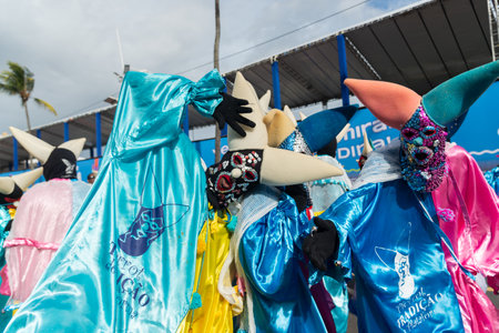 Salvador, Bahia, Brazil - February 11, 2023: Group of masked and costumed people parade in Fuzue, pre-carnival in Salvador, Bahia, Brazil.のeditorial素材