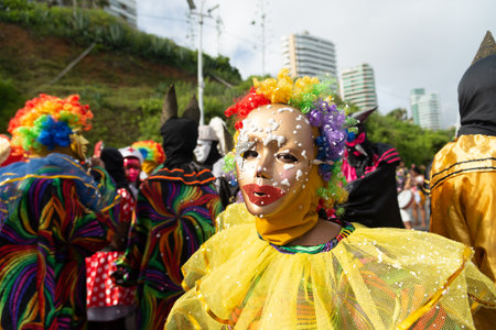 Salvador, Bahia, Brazil - February 11, 2023: Members of the masked cultural group from Maragojipe are parading at Fuzue, pre-carnival in the city of Salvador, Bahia.のeditorial素材