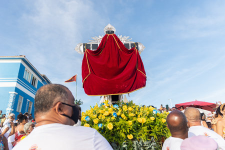 Salvador, Bahia, Brazil - December 31, 2021: Faithful are seen carrying the scaffold with the image...