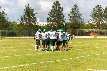 Camacari, Bahia, Brazil - September 30, 2023: American football players are seen gathered on the...