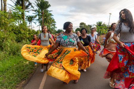 Valenca, Bahia, Brazil - June 28, 2022: Women dance during Levada do Mastro to honor Saint Peter in...