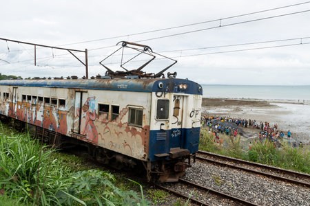 Salvador, Bahia, Brazil - August 30, 2019: View of the suburban passenger train traveling through the Coutos neighborhood in the city of Salvador, Bahia.のeditorial素材