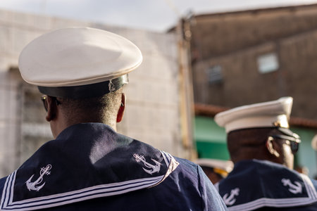 Saubara, Bahia, Brazil - August 06, 2022: Men from a Marujada, dressed as sailors, are seen parading through the streets of the city of Saubara, in Bahia.のeditorial素材