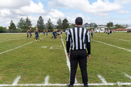 Camacari, Bahia, Brazil - September 30, 2023: Athletes are seen running and fighting for the ball during an American football game at the Armando Oliveira stadium, in CamaÃ§ari, Bahia.のeditorial素材