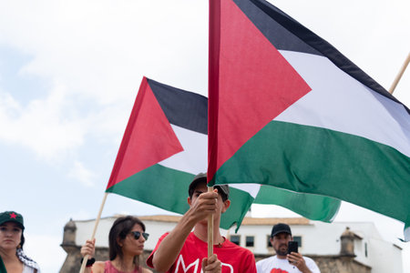 Salvador, Bahia, Brazil - November 11, 2023: Protesters are seen holding the Palestinian flag during a protest in the city of Salvador, Bahia.のeditorial素材
