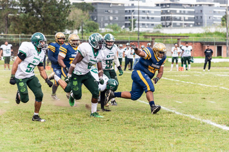 Camacari, Bahia, Brazil - September 30, 2023: American football players watching for the ball at the Armando Oliveira stadium in the city of Camacari, Bahia.のeditorial素材